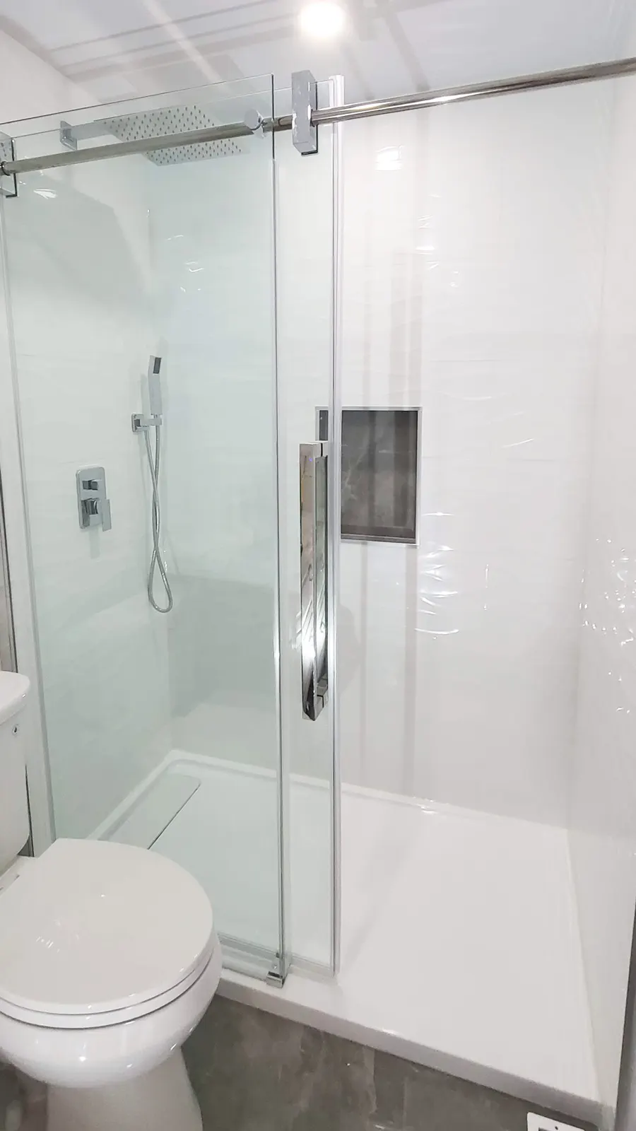 Walk-in glass shower with large-format porcelain tile and vertical mosaic accent strip, photo 4