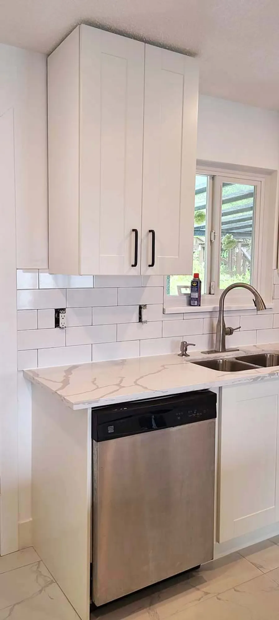 Kitchen renovation with tile backsplash and new countertops, photo 1