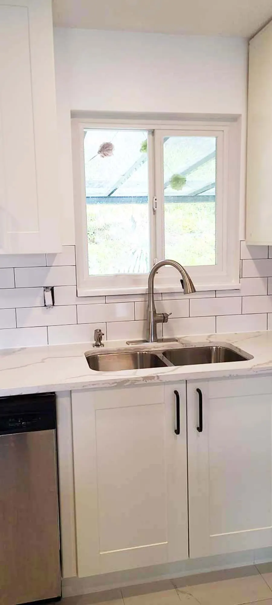 Kitchen renovation with tile backsplash and new countertops, photo 2