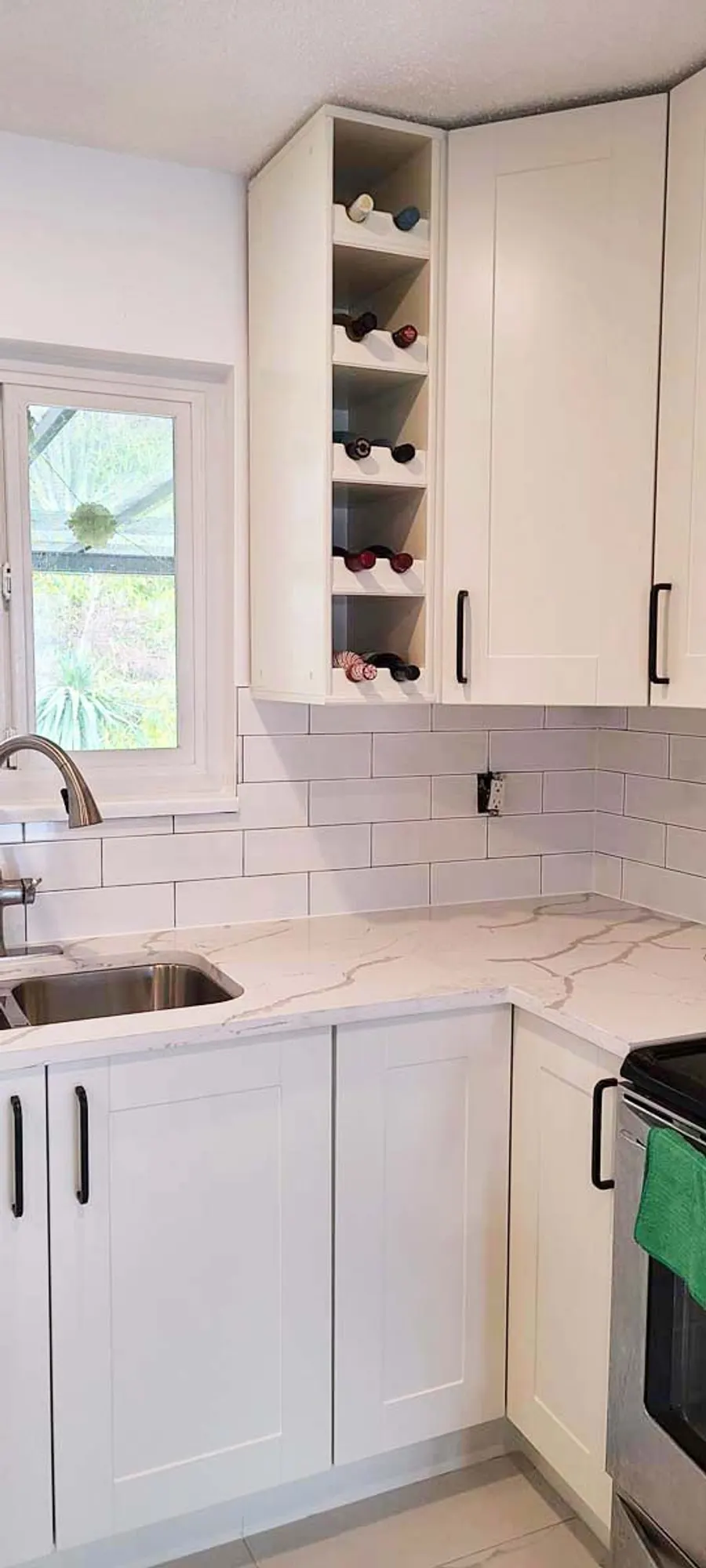 Kitchen renovation with tile backsplash and new countertops, photo 3
