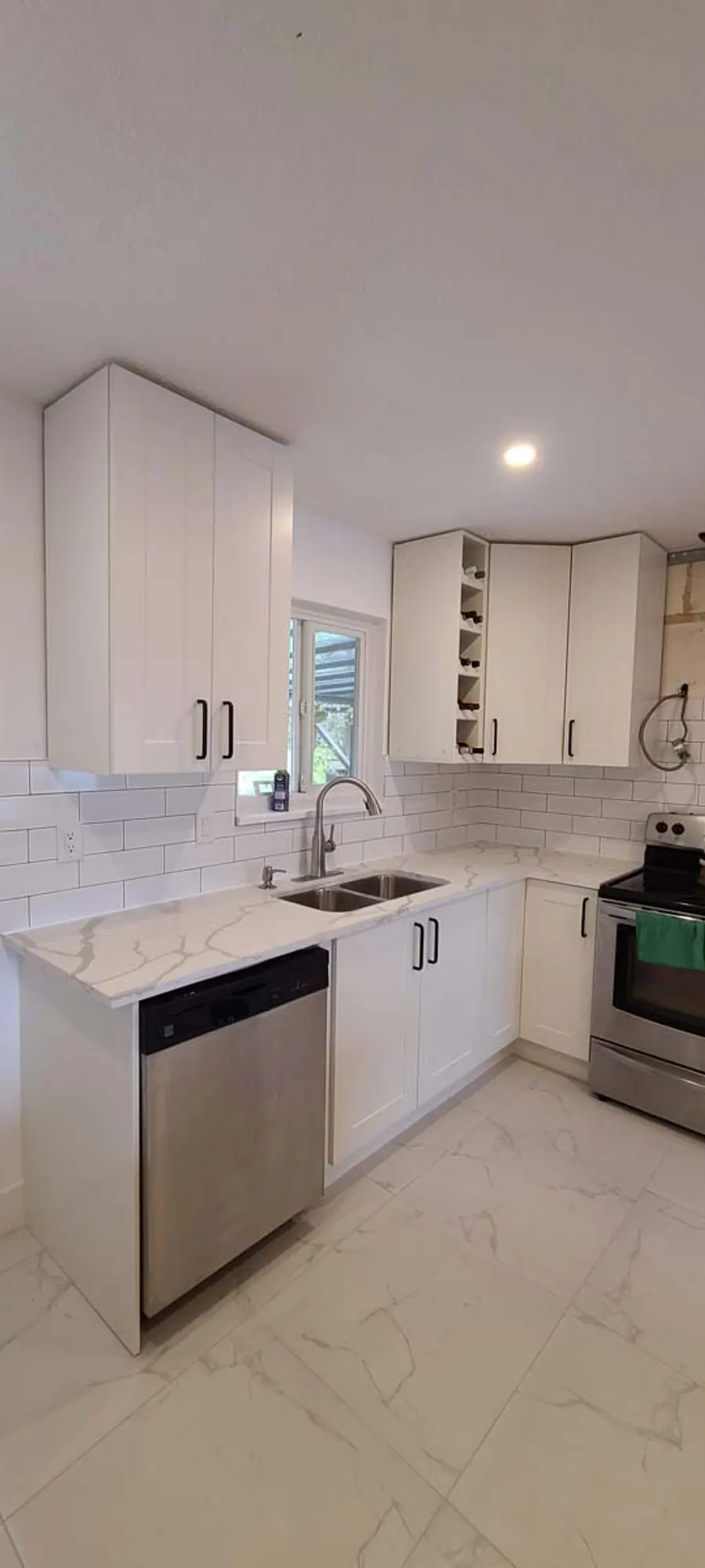 Kitchen renovation with tile backsplash and new countertops, photo 9