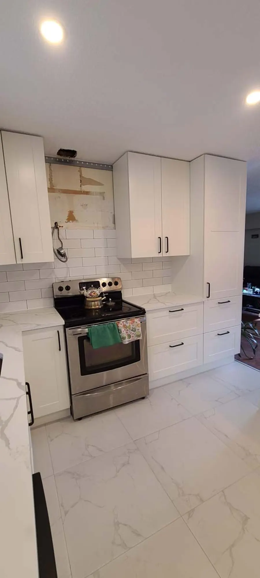 Kitchen renovation with tile backsplash and new countertops, photo 10