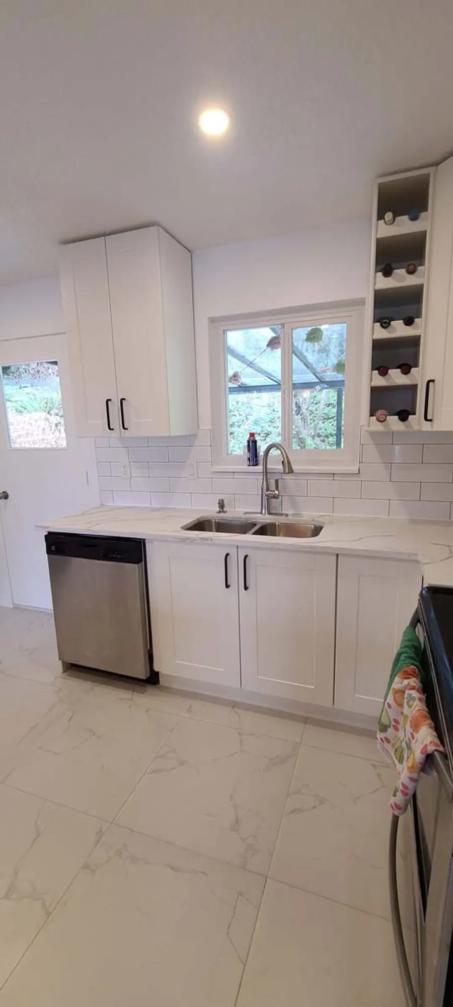 Kitchen renovation with tile backsplash and new countertops, photo 11