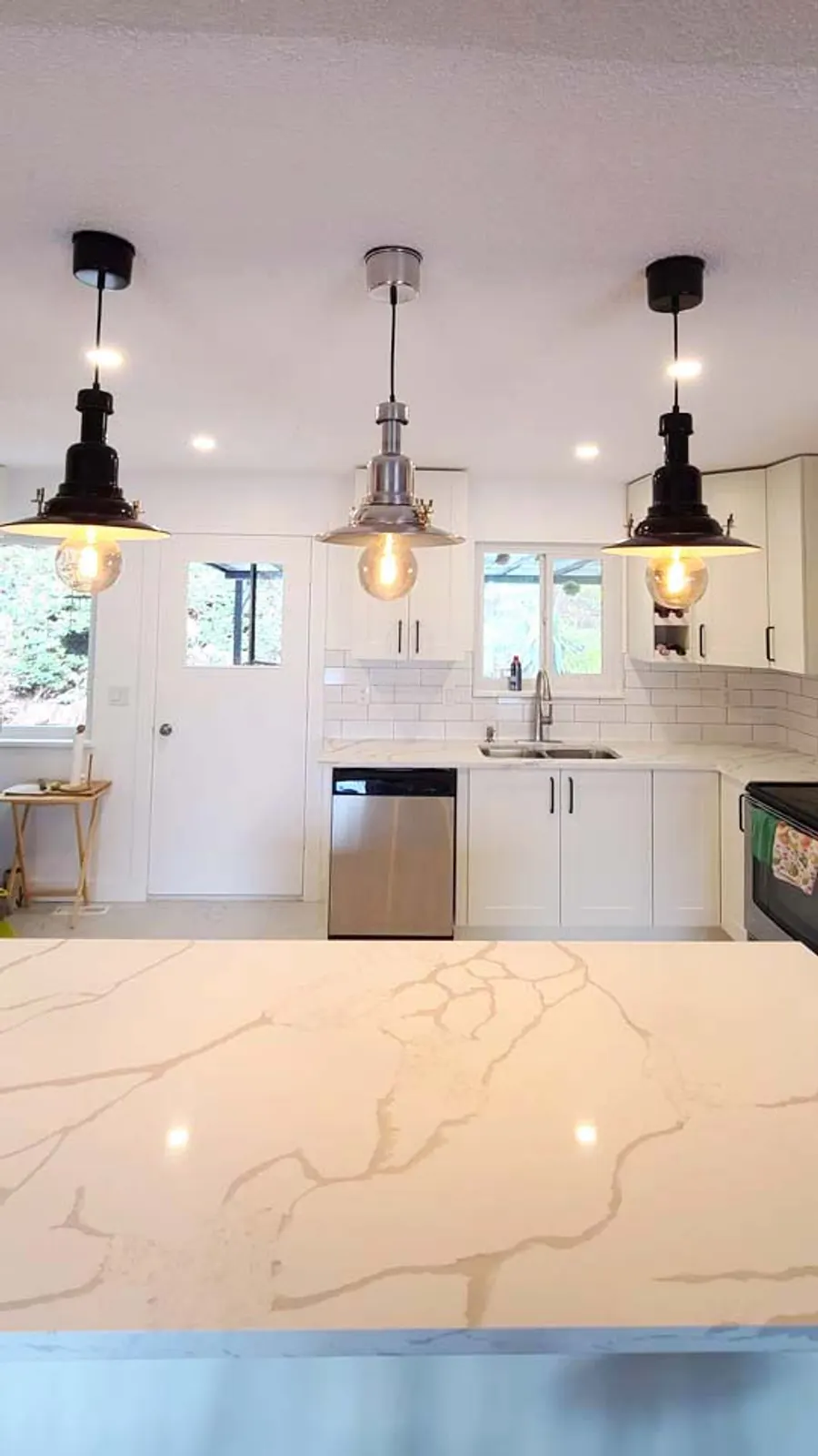 Kitchen renovation with tile backsplash and new countertops, photo 14