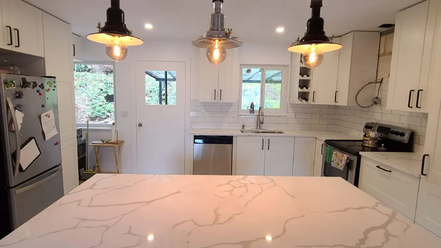 Kitchen renovation with tile backsplash and new countertops, photo 21