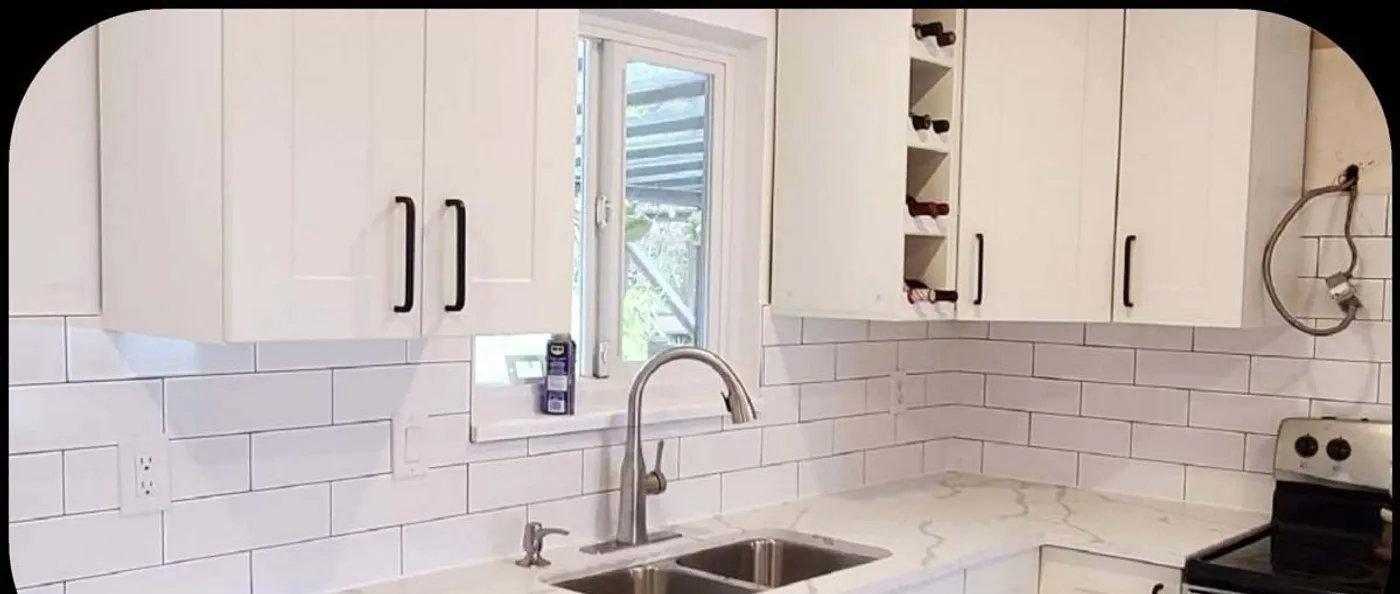 Roham kitchen: from 1980s oak to a white quartz island, Range wall and subway backsplash, before
